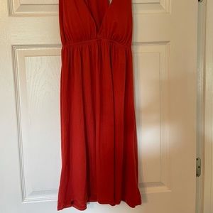 Orange cotton dress with deep V neck. Built in padding in bust.